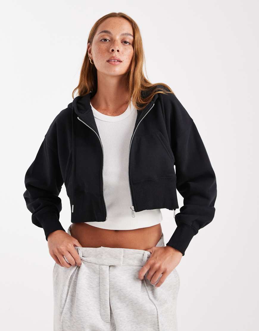 Cotton On - Cropped-Kapuzenjacke aus flauschigem Fleece in Schwarz mit durchgehendem Reißverschluss Cotton On - Cropped-Kapuzenjacke aus flauschigem Fleece in Schwarz mit durchgehendem Reißverschluss von Cotton On