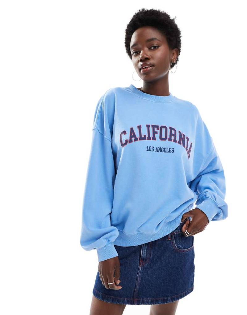 Cotton On - Sweatshirt in Blau mit lizenzierter California-Grafik von Cotton:On