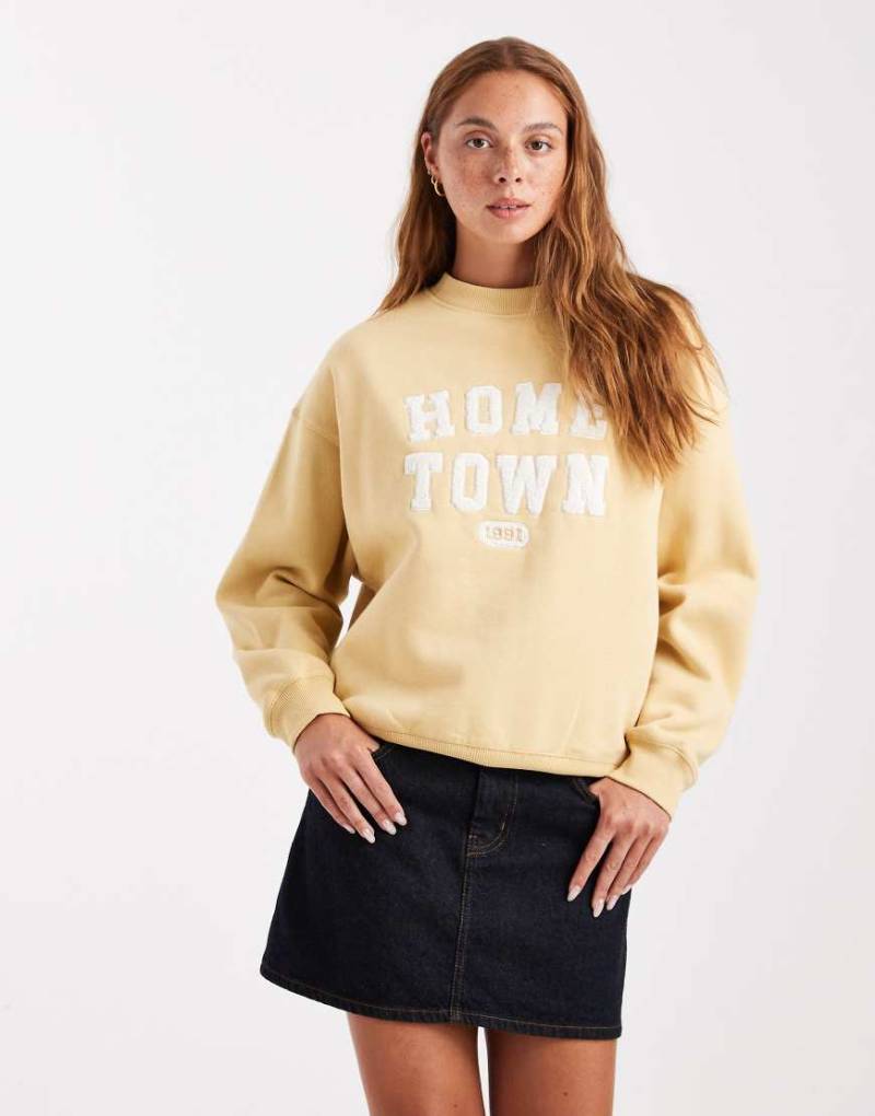 Cotton On - Vintage-Sweatshirt in verwaschenem Senfgelb mit Grafik von Cotton:On