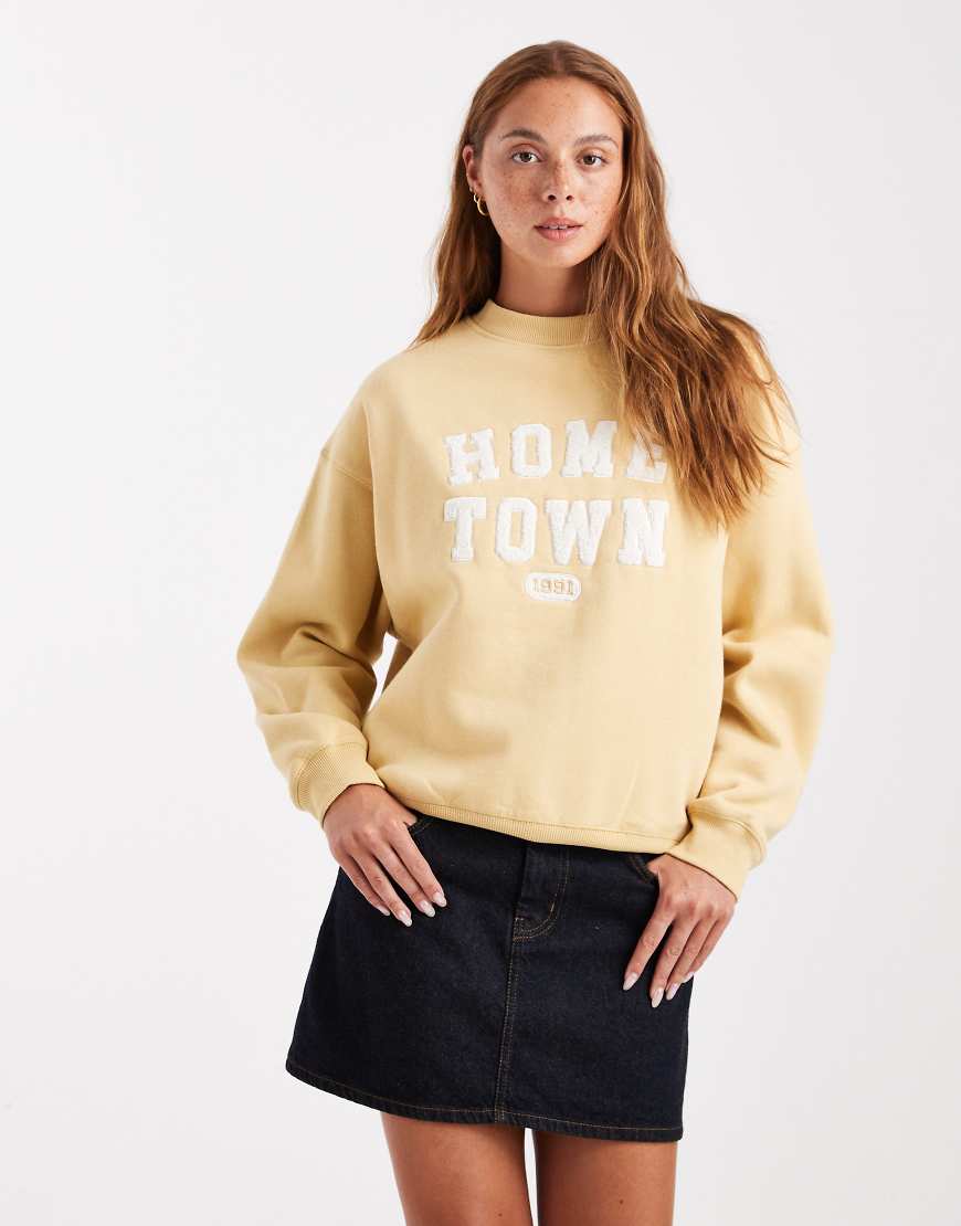 Cotton On - Vintage-Sweatshirt in verwaschenem Senfgelb mit Grafik von Cotton:On