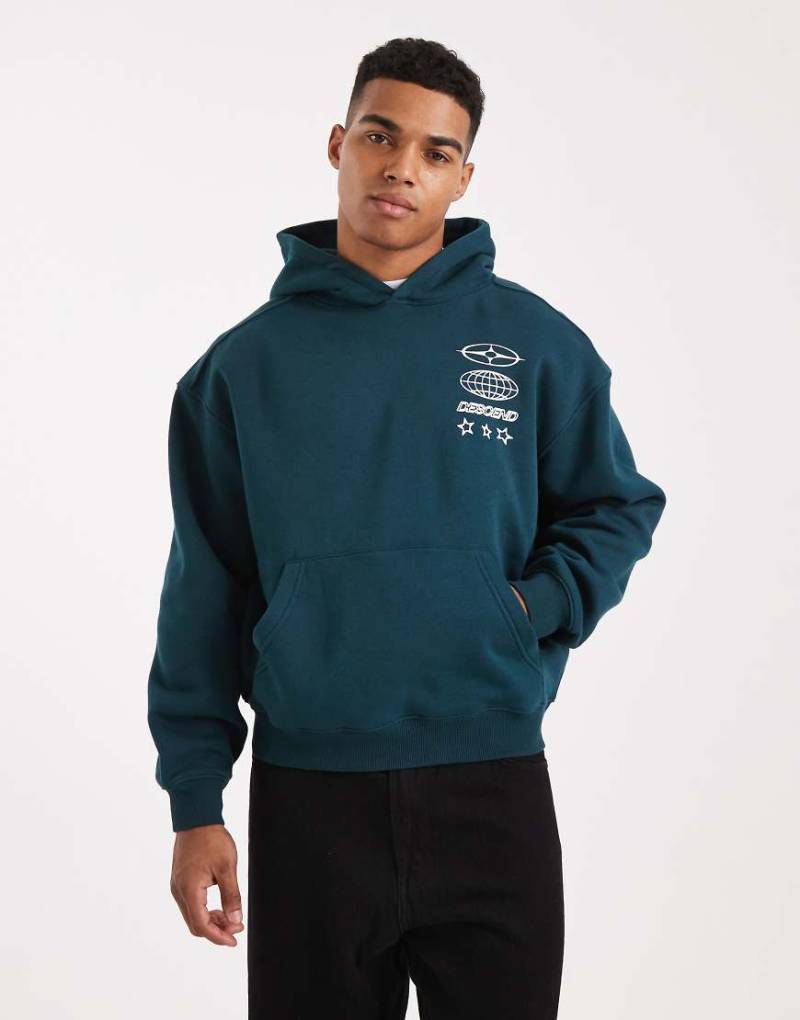 Cotton On - Cropped-Fit-Kapuzenpullover in Tiefseepetrol mit Grafik-Grün von Cotton On