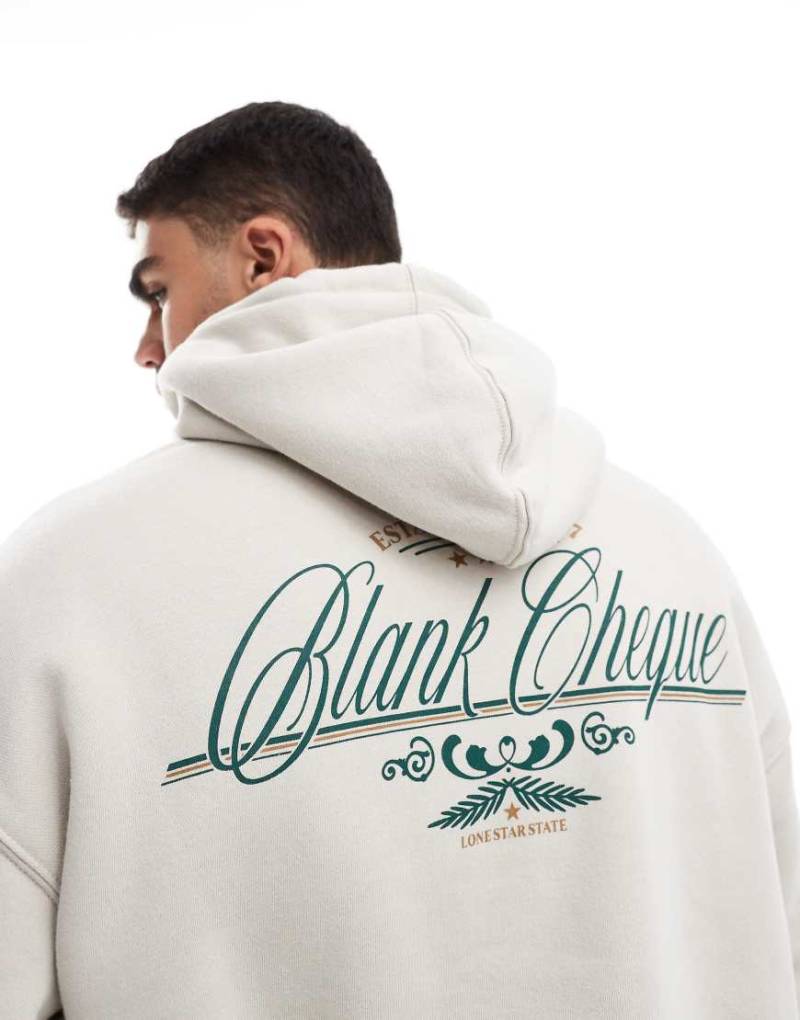 Cotton On - Kastiger Kapuzenpullover in Creme mit „Blank Cheque"-Grafikprint-Neutral von Cotton:On