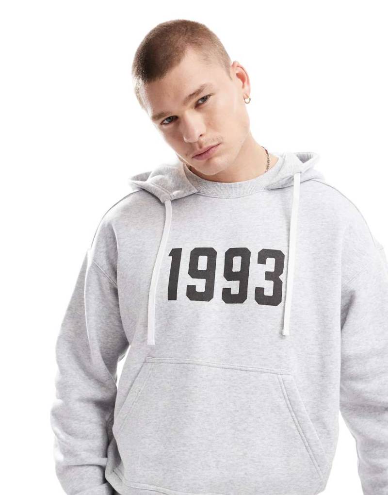 Cotton On - Kastiger Kapuzenpullover in meliertem Grau mit „1993"-Print von Cotton:On