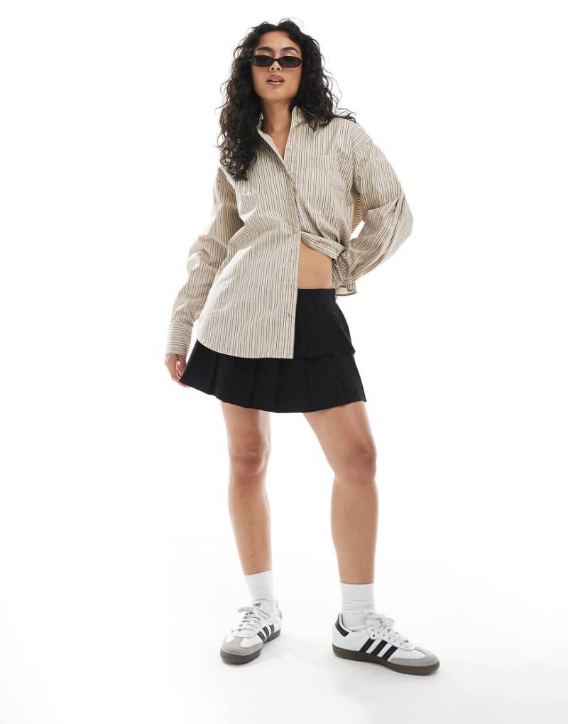 Cotton On - Luis - Zweilagiger Mini-Faltenrock in Schwarz von Cotton On