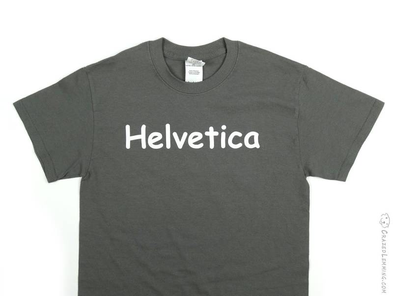 Helvetica Im Comic Sans Grafik Design Schrift Tshirt von CrazedLemming