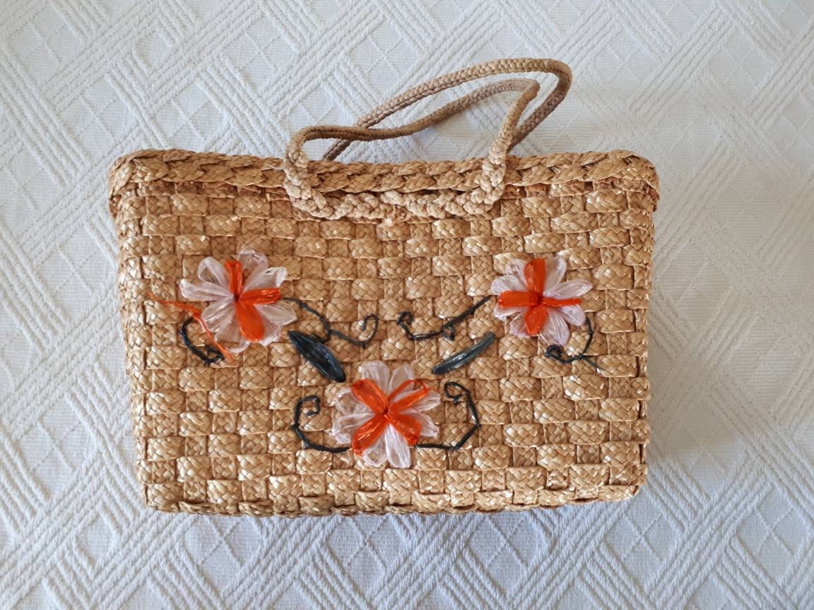 Rattan-Blumentasche Rattan-Blumentasche von CribsandCo