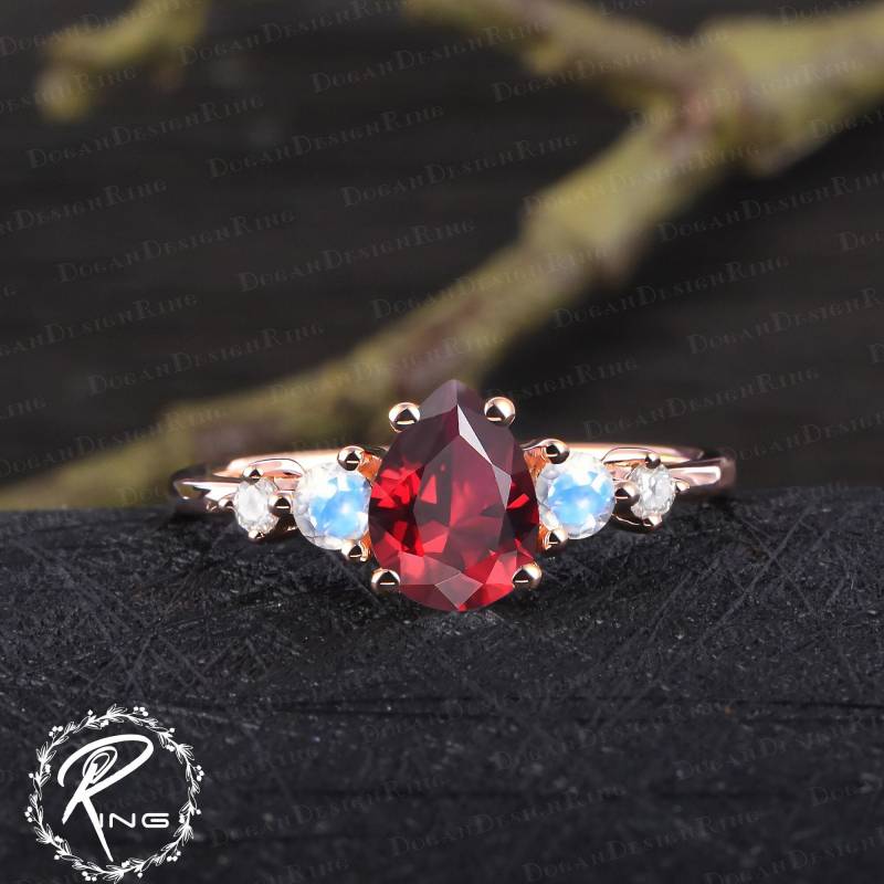 Unique Pear Shaped Ruby Engagement Ring Art Deco Red Gemstone Promise Solid 14K Rose Gold Moonstone Anniversary Gifts For Women von DoganCustomizedGifts