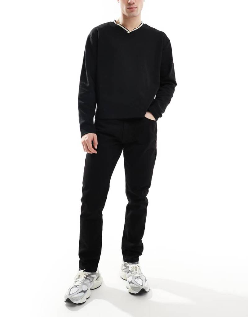 DTT - Feste Jeans in Schwarz mit schmalem Schnitt DTT - Feste Jeans in Schwarz mit schmalem Schnitt von Don't Think Twice