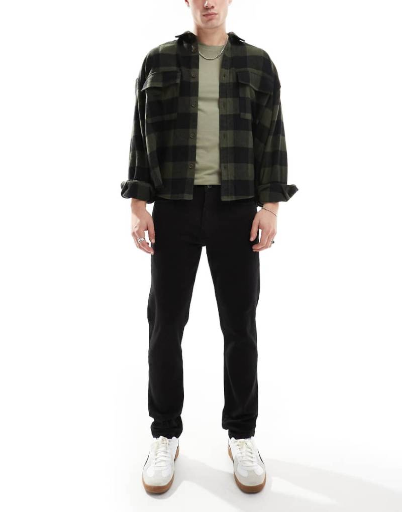 DTT - Schmal geschnittene Stretch-Jeans in Schwarz von Don't Think Twice