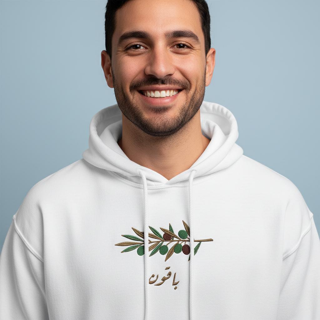Das Ist Ein Unisex-Sweatshirt Mit Dem Aufdruck "We Will Stay" | Wir Werden Bleiben Und Einem Olivenzweig-Design Das Ist Ein Unisex-Sweatshirt Mit Dem Aufdruck "We Will Stay" | Wir Werden Bleiben Und Einem Olivenzweig-Design von ELBALAD