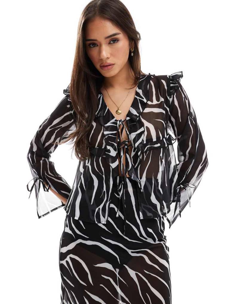 Esmee - Exclusive - Transparentes Strandoberteil mit Zebramuster, gebundener Vorderseite und Rüschenborte-Bunt von Esmée