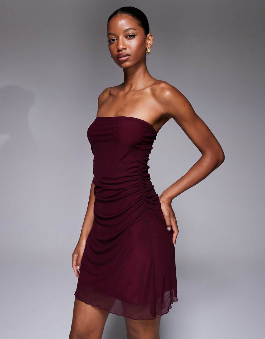 Fashionkilla - Trägerloses Minikleid in Pflaumenlila mit Raffung in der Taille und Netzstoff-Overlay Fashionkilla - Trägerloses Minikleid in Pflaumenlila mit Raffung in der Taille und Netzstoff-Overlay von Fashionkilla