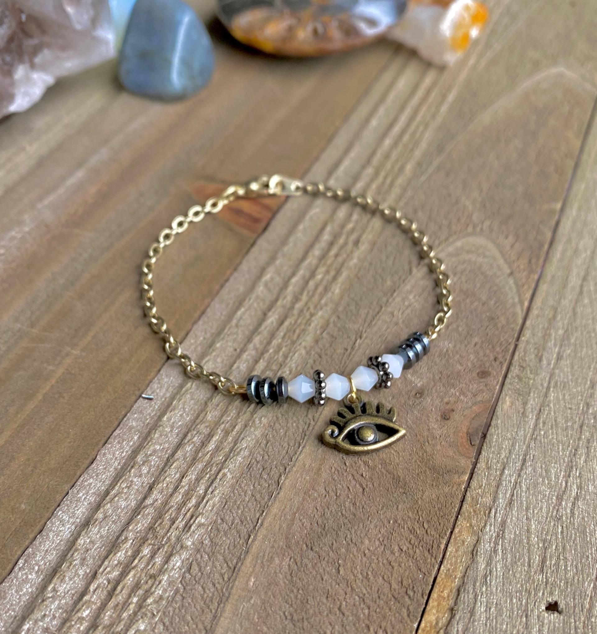 Heilung & SchutzQuarz Kristall Und Hämatit Evil Eye Armband, Handgemachter Edelstein Schmuck Heilung & SchutzQuarz Kristall Und Hämatit Evil Eye Armband, Handgemachter Edelstein Schmuck von FlameyFairyCrafts