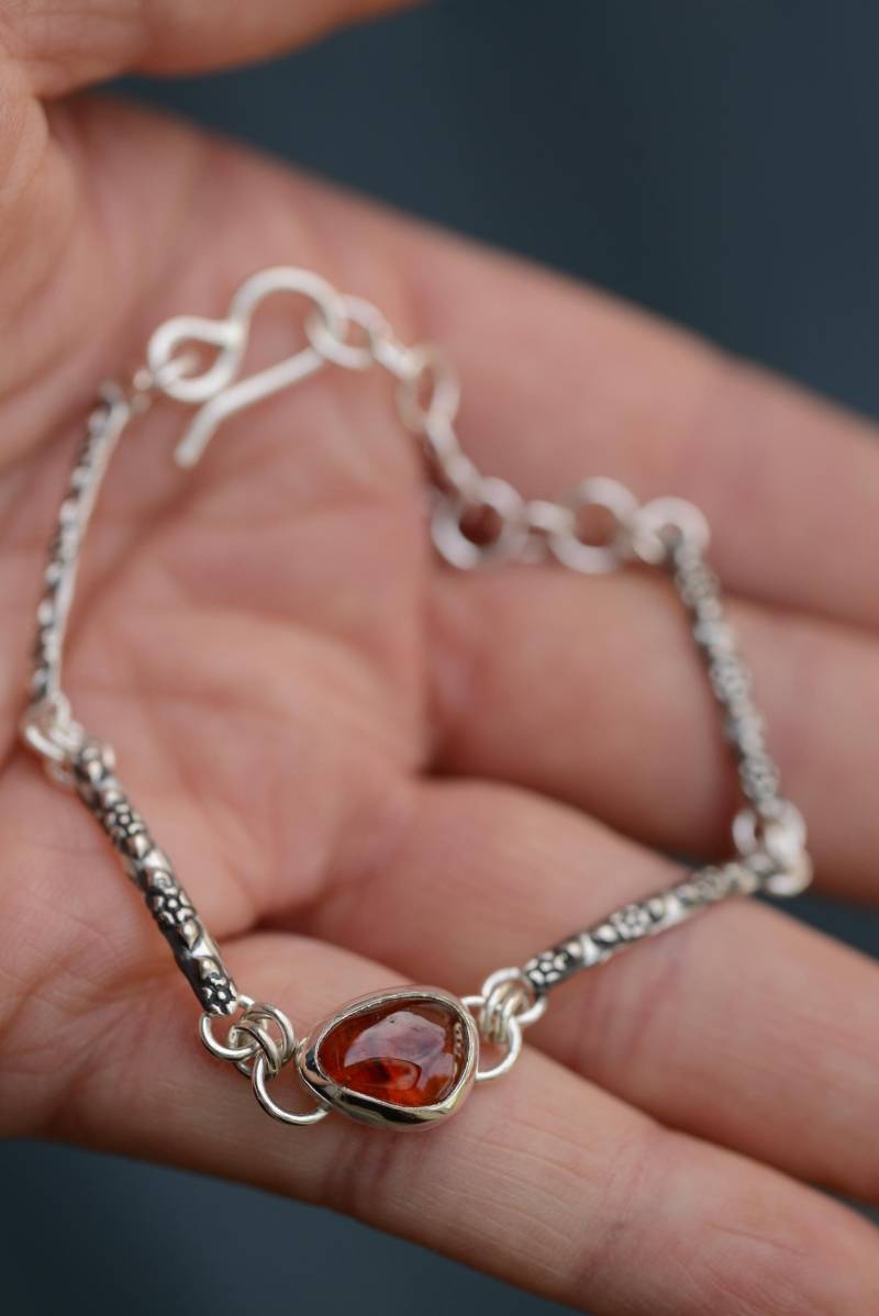 Silversmith Bracelet With Flower Texture & A Natural Red Garnet Gemstone, Handmade Oxidized Silver By Formvollendung von Formvollendung