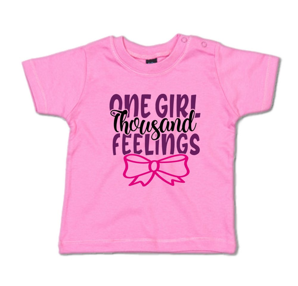G-graphics T-Shirt One girl, thousand feelings Baby T-Shirt, mit Spruch / Sprüche / Print / Aufdruck von G-graphics
