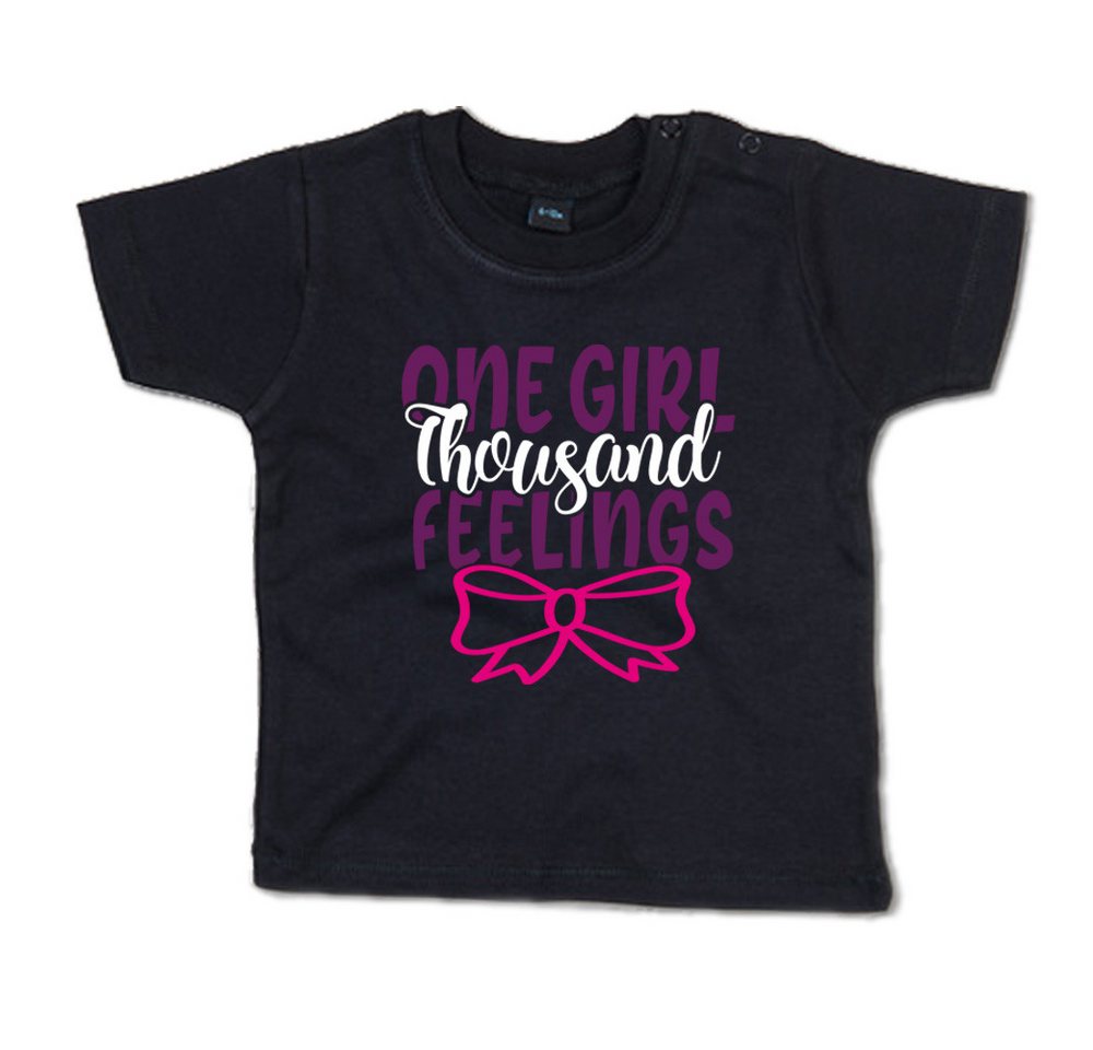 G-graphics T-Shirt One girl, thousand feelings Baby T-Shirt, mit Spruch / Sprüche / Print / Aufdruck von G-graphics