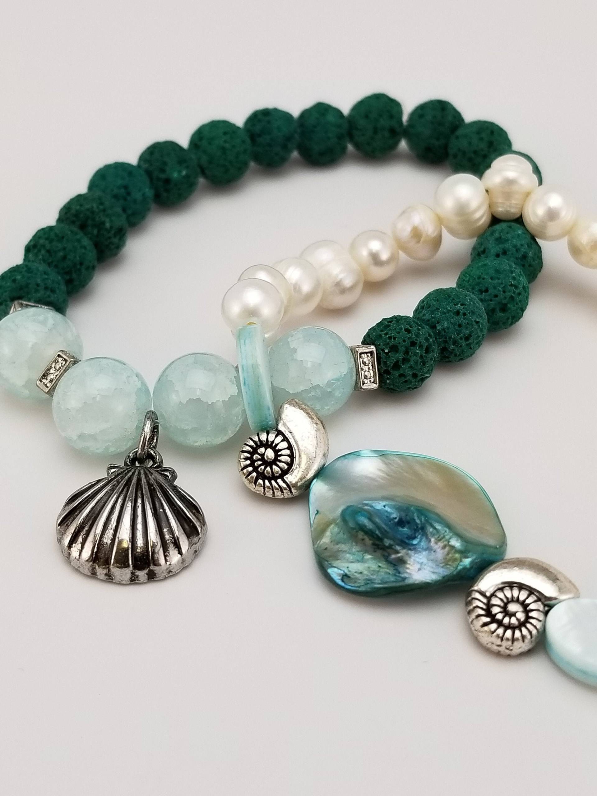 Armbänder. Aquafarbene Armbänder Mit Lavasteinen Und Süßwasserperlen Armbänder. Aquafarbene Armbänder Mit Lavasteinen Und Süßwasserperlen von GGRosaryDesigns