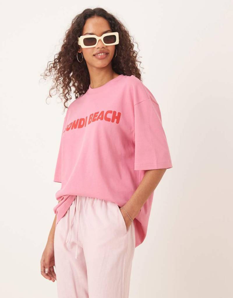 Gina Tricot - Kurzärmliges Oversize-T-Shirt in Rosa mit „Bondi Beach"-Grafik von GINA TRICOT