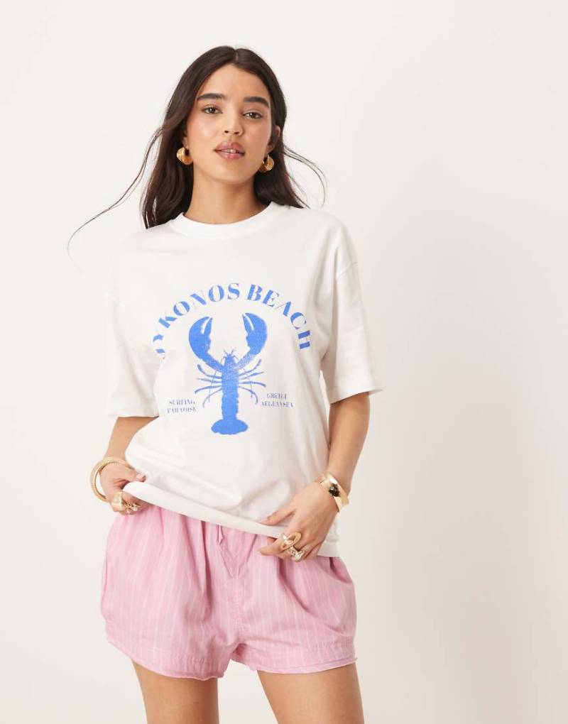 Gina Tricot - Kurzärmliges Oversize-T-Shirt in Weiß mit „Mykonos Beach"-Grafikprint von GINA TRICOT