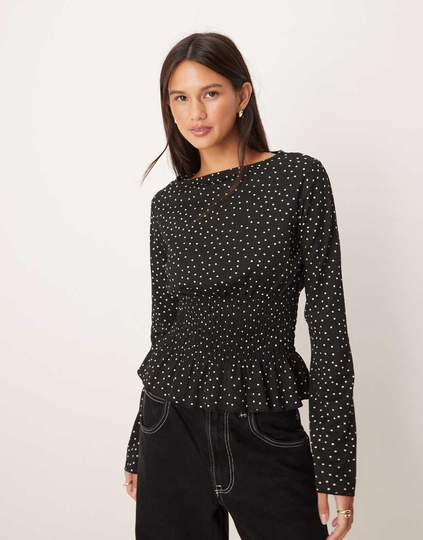 Gina Tricot - Langärmliges Hängeroberteil in Schwarz mit Polka Dots und Schößchensaum von GINA TRICOT