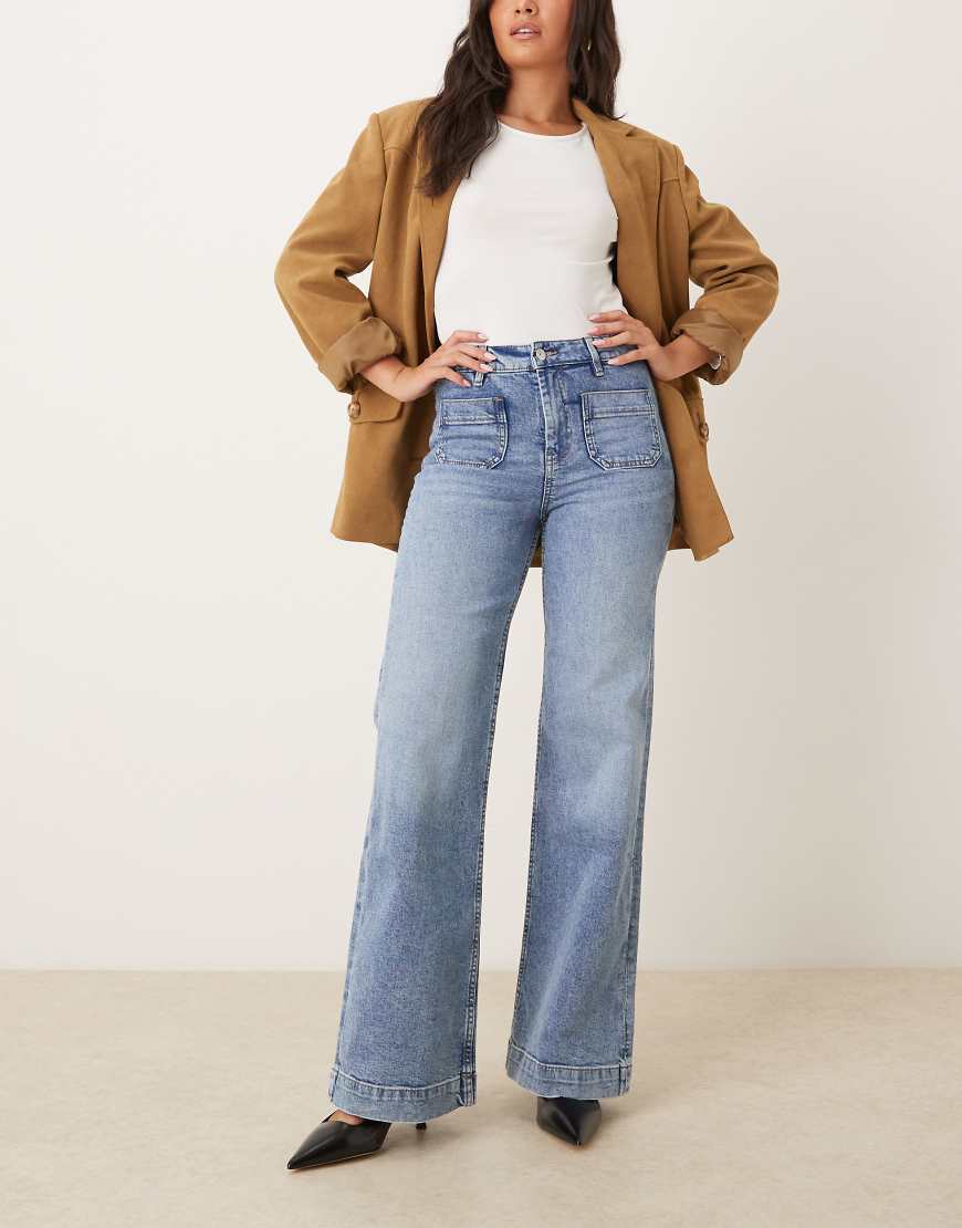 Gina Tricot - Schlagjeans in mittelblauer Waschung mit Vordertaschen und weitem Bein Gina Tricot - Schlagjeans in mittelblauer Waschung mit Vordertaschen und weitem Bein von GINA TRICOT