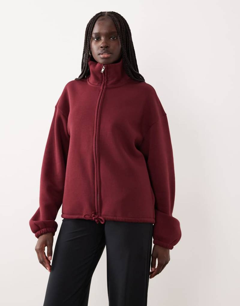 Gina Tricot - Sport-Oberteil aus weichem Fleece-Flor in Burgunderrot mit durchgehendem Reißverschluss von GINA TRICOT