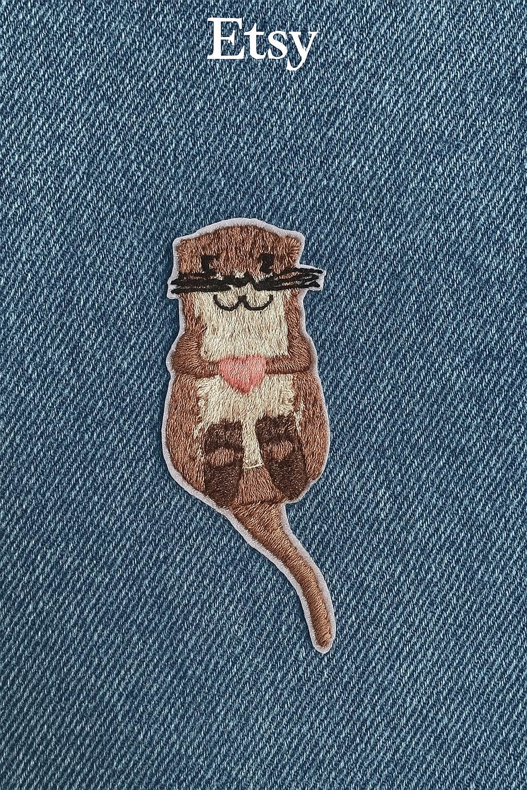 Otter Aufnäher - Bügelpatch/Applikation | 6, 5 X 2, 6 cm Otter Aufnäher - Bügelpatch/Applikation | 6, 5 X 2, 6 cm von Geschenkebud