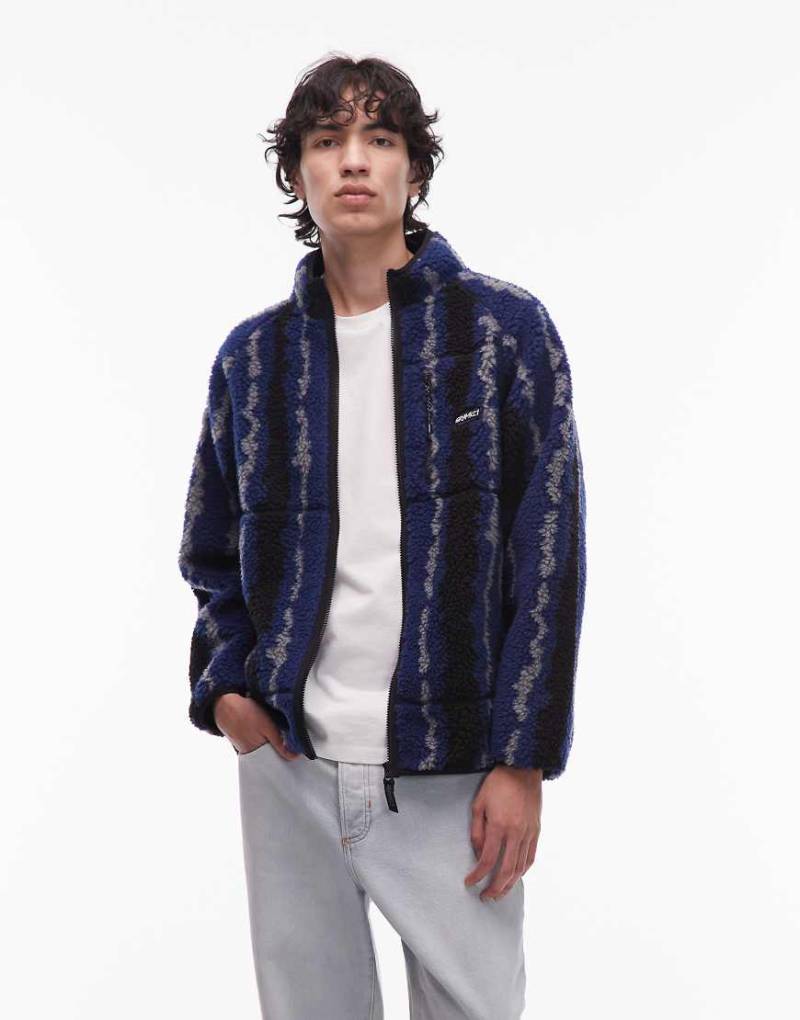 Gramicci - Jacke aus Sherpa-Stoff in Blau und Schwarz mit welligem Muster-Bunt von Gramicci