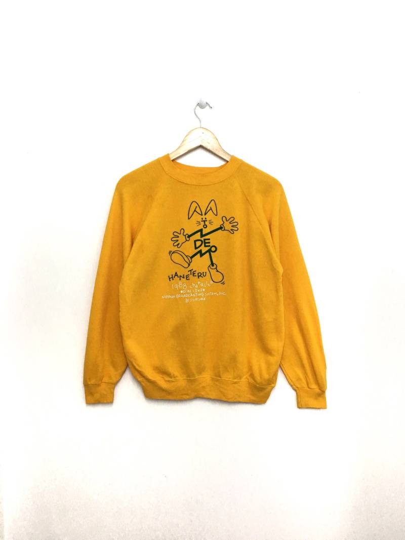 Selten Vintage 1988 Haneteru Sweatshirt Jumper Cartoon Gelbe Farbe Mittlere Größe Made in Usa Selten Vintage 1988 Haneteru Sweatshirt Jumper Cartoon Gelbe Farbe Mittlere Größe Made in Usa von GreatVtgApparels