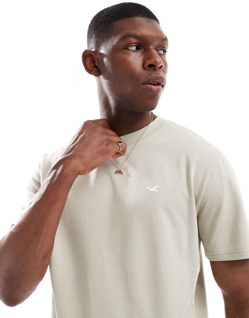 Hollister - Cooling - Kastiges T-Shirt in Hellgrün mit Markenlogo Hollister - Cooling - Kastiges T-Shirt in Hellgrün mit Markenlogo von Hollister