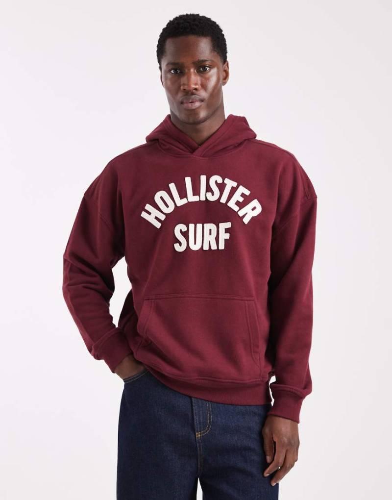 Hollister - Kastiger Frottee-Kapuzenpullover in Rot mit Logo von Hollister