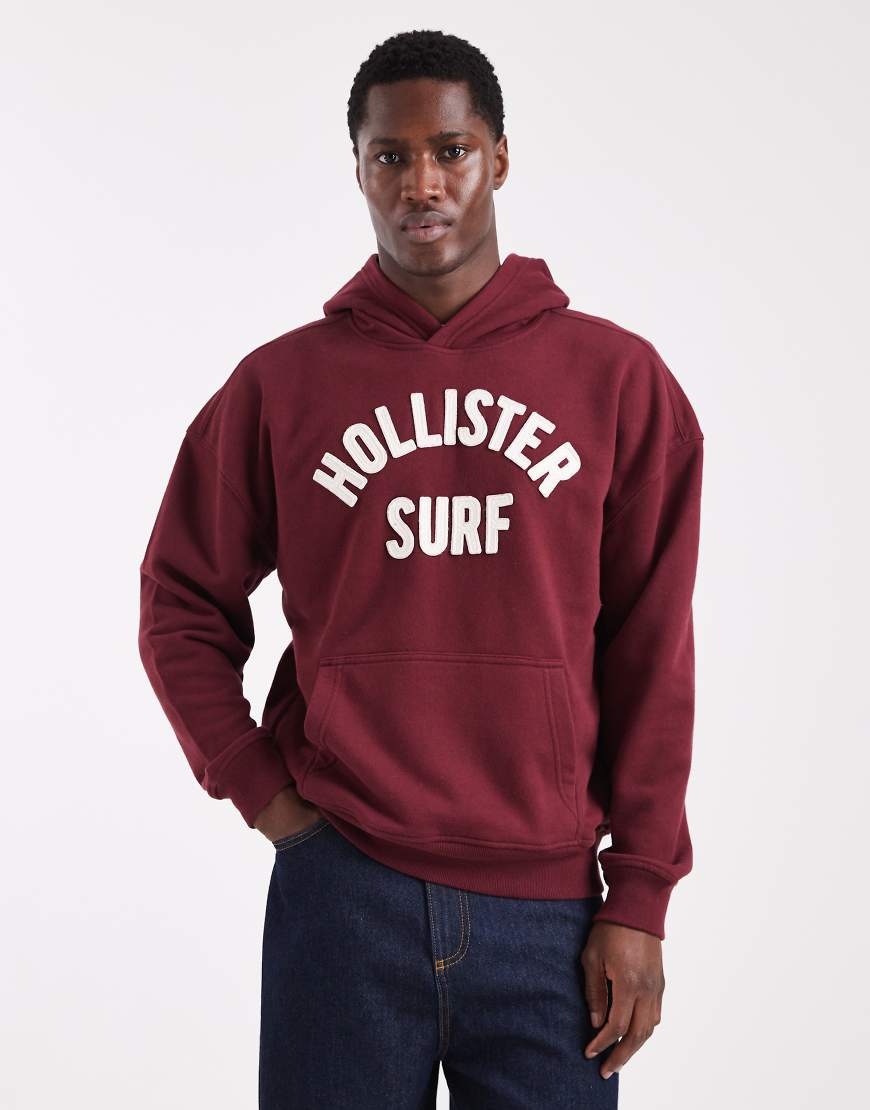 Hollister - Kastiger Frottee-Kapuzenpullover in Rot mit Logo von Hollister
