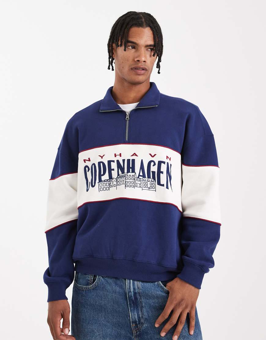 Hollister - Kastiges Sweatshirt in Marineblau mit College-Grafik und kurzem Reißverschluss von Hollister