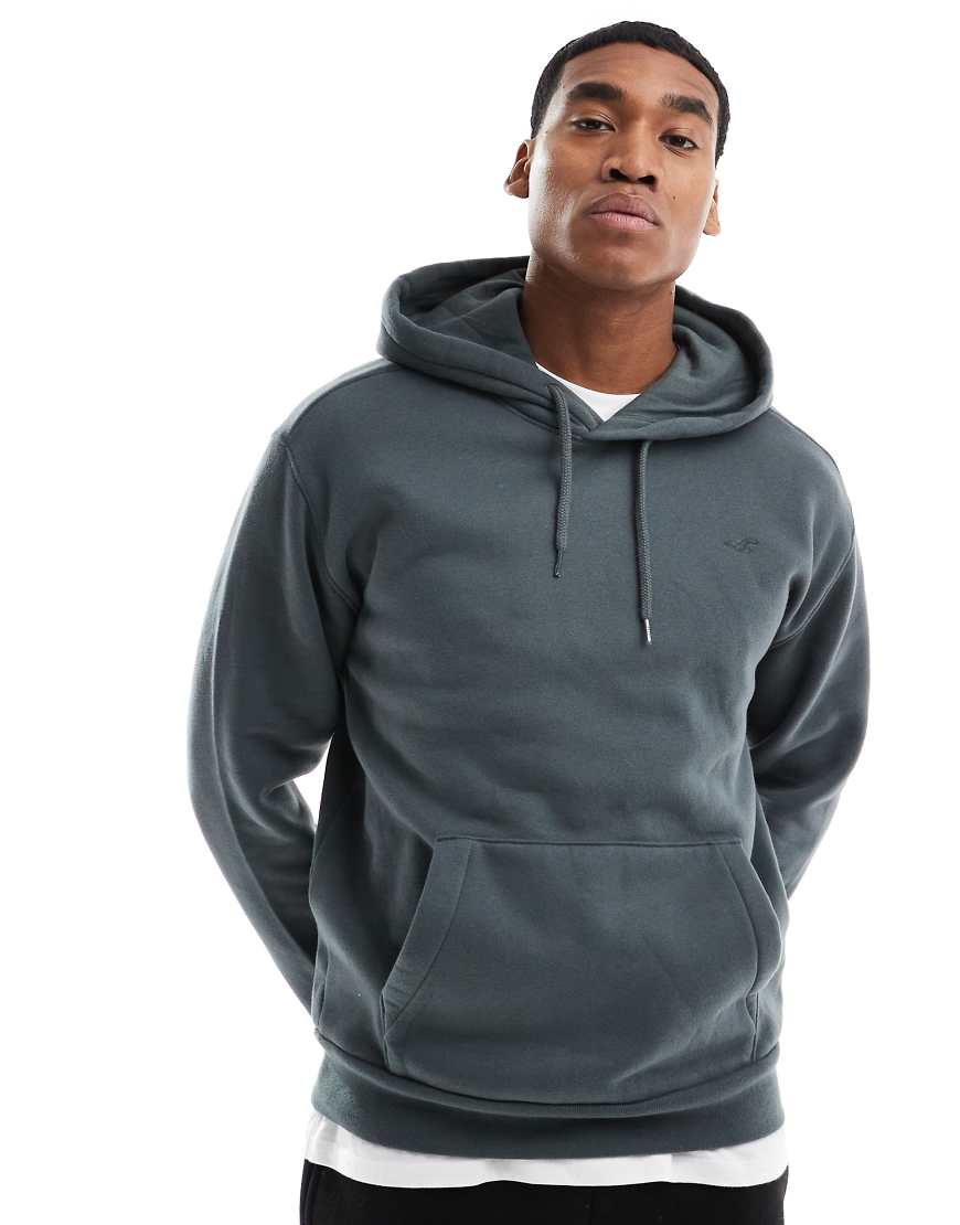 Hollister - Locker geschnittener Kapuzenpullover in Khaki mit Markenlogo-Grün Hollister - Locker geschnittener Kapuzenpullover in Khaki mit Markenlogo-Grün von Hollister