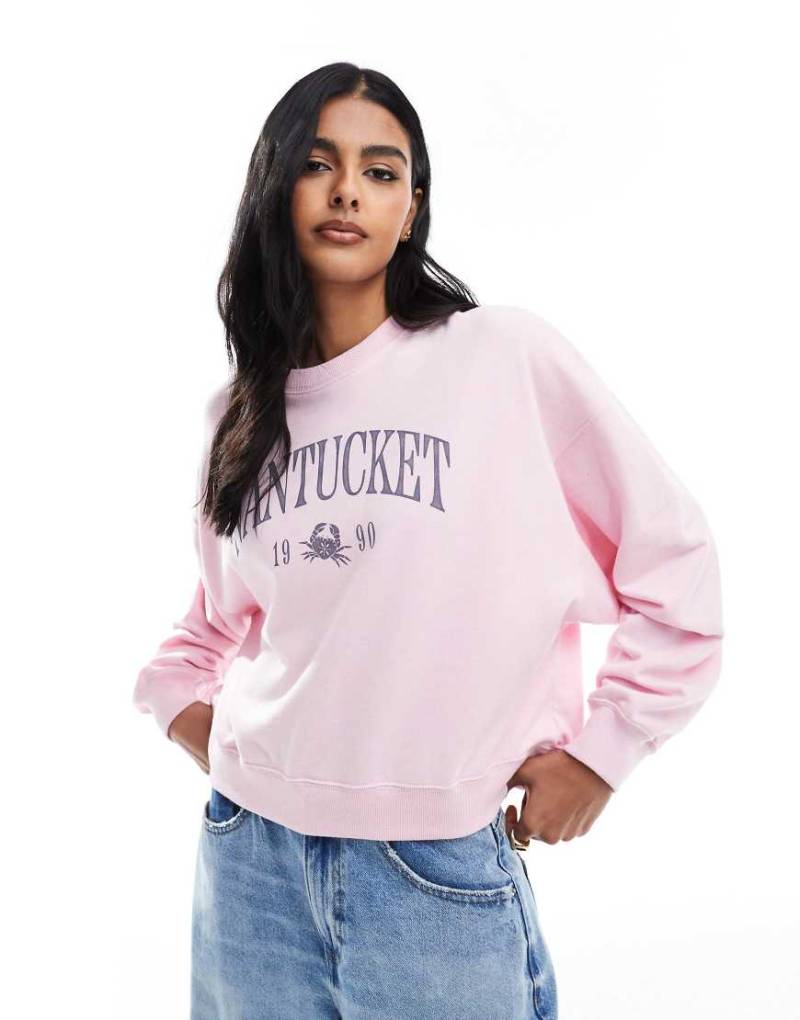 Hollister - Sweatshirt in staubigem Rosa mit Rundhalsausschnitt und Grafik vorne von Hollister