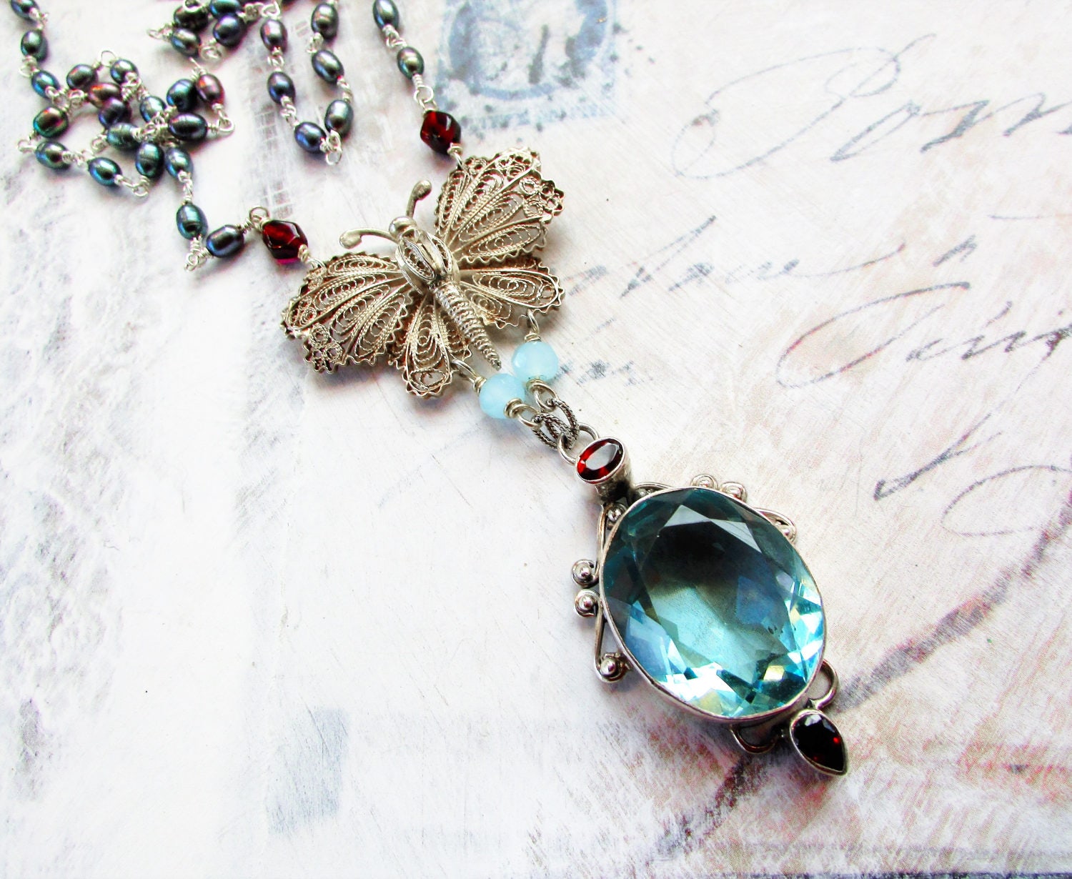 Le Papillon D'aqua, Vintage Filigree Butterfly, Blue Topaz, Garnets, Peacock Pearls Sterling Silver Statement Necklace, Hollywood Hillbilly Le Papillon D'aqua, Vintage Filigree Butterfly, Blue Topaz, Garnets, Peacock Pearls Sterling Silver Statement Necklace, Hollywood Hillbilly von HollywoodHillbilly