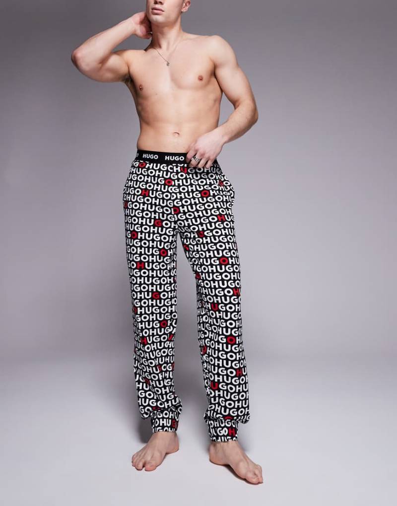 HUGO Bodywear - Tortuga - Hose in Schwarz mit Logo-Muster von Hugo Red