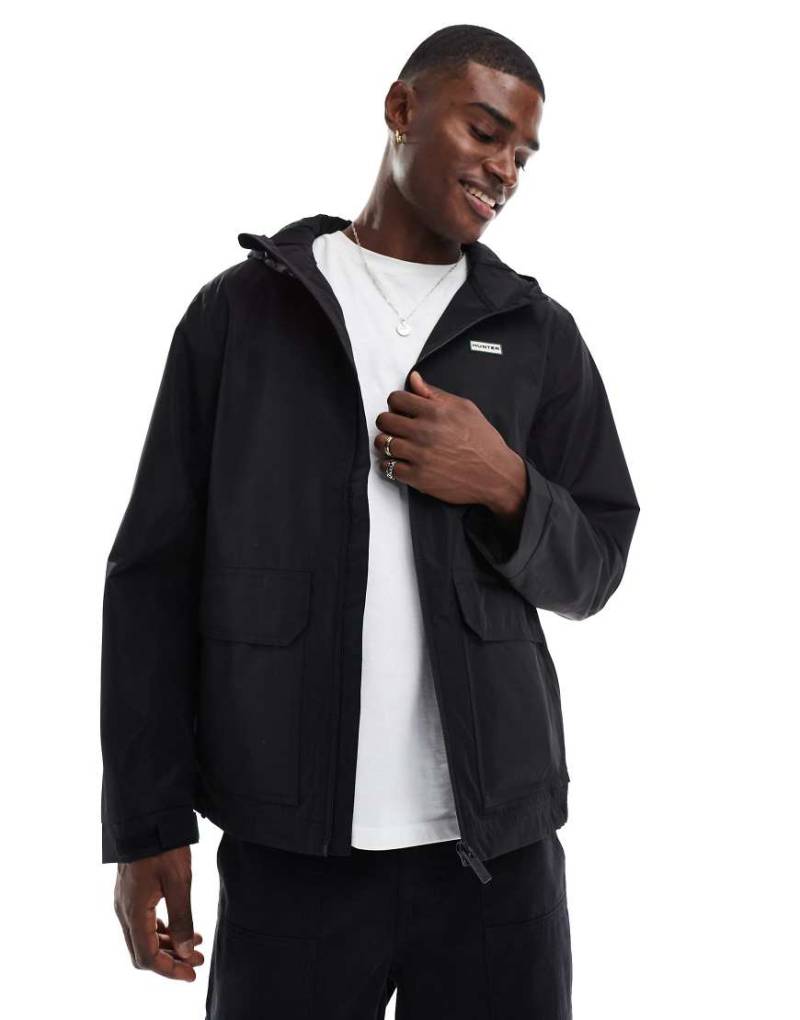 Hunter - James - Wasserdichte Jacke in Schwarz mit Kapuze Hunter - James - Wasserdichte Jacke in Schwarz mit Kapuze von Hunter