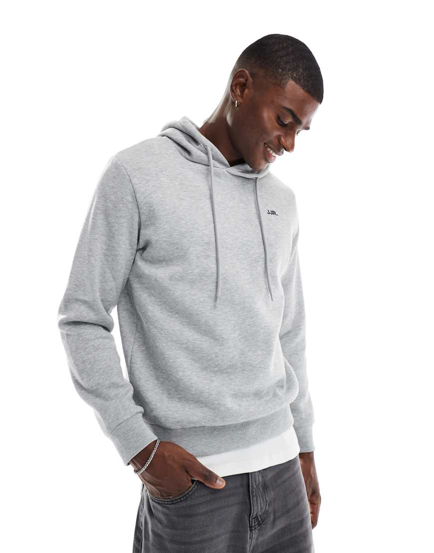 JJ Rebel - Kapuzenpullover in Grau mit kleinem Logo auf der Brust JJ Rebel - Kapuzenpullover in Grau mit kleinem Logo auf der Brust von JJ Rebel