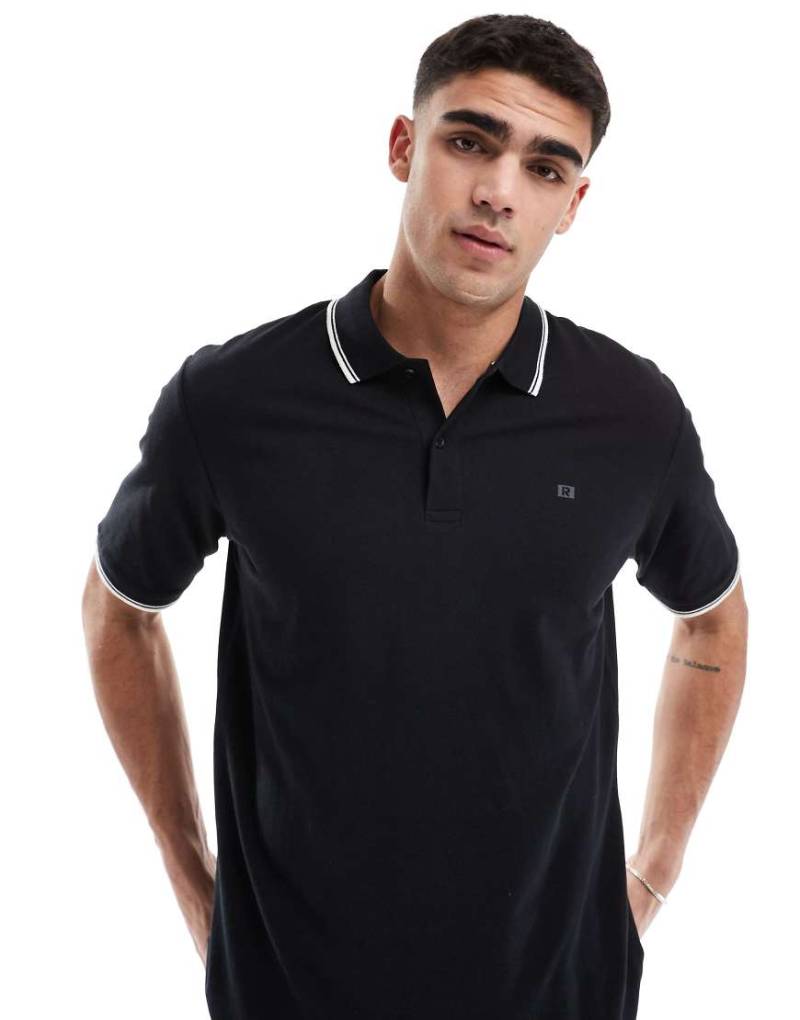 JJ Rebel - Polohemd aus Pikee in Schwarz mit Paspelierung von JJ Rebel