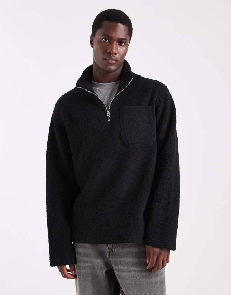 Jack & Jones - Fleece-Sweatshirt in Schwarz mit kurzem Reißverschluss und Muster von Jack & Jones