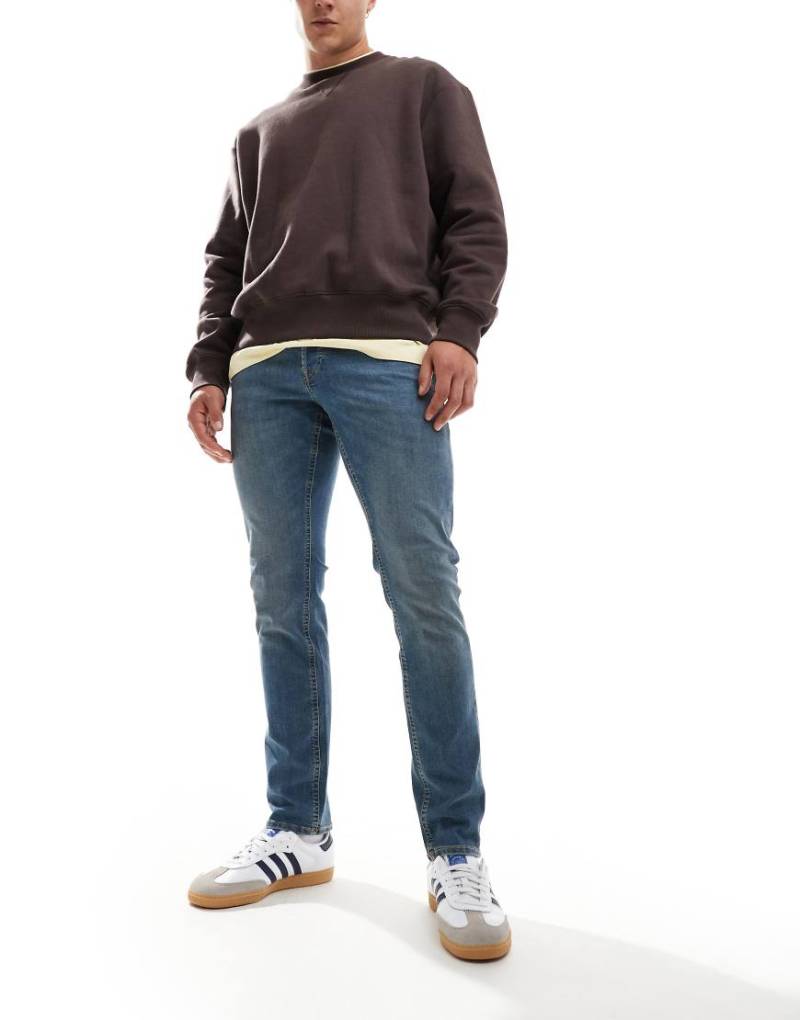 Jack & Jones - Glenn - Schmal geschnittene Jeans in verwaschenem Mittelblau von Jack & Jones