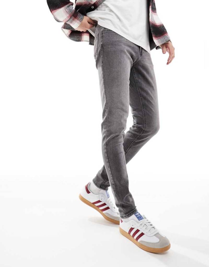 Jack & Jones - Schmal zulaufende und geschnittene Jeans in grauer Waschung von Jack & Jones