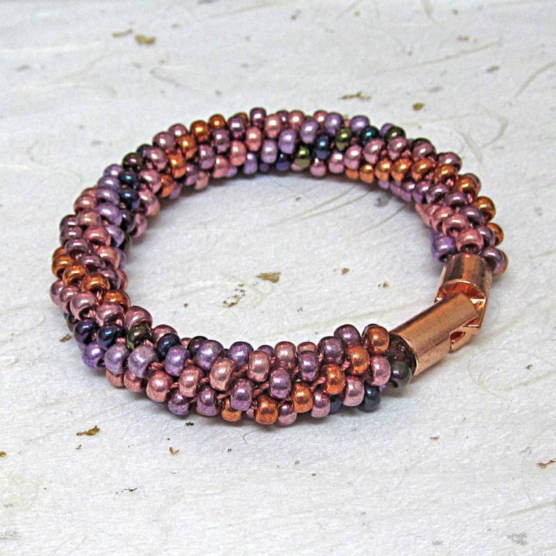 Kumihimo Armband Perlenarmband Lila Und Roségold Kumihimo Armband Perlenarmband Lila Und Roségold von JanislaJewels