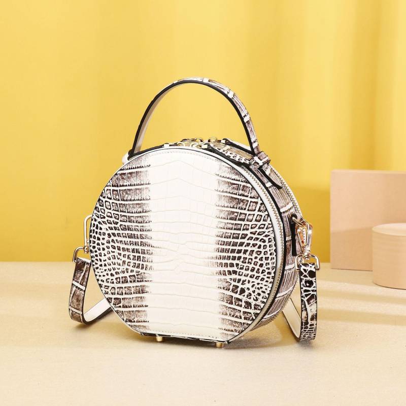 Eine klassische runde Pfannkuchen-Tasche für Damen mit Krokodilbauchmuster, eine kleine Umhängetasche für Damen und eine Handtasche von Joom DACH