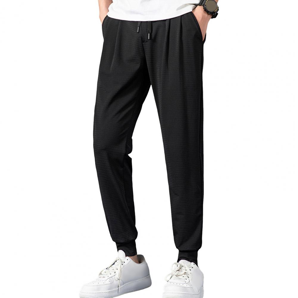 Herren Jogginghose aus Eisseide, elastischer Kordelzug in der Taille, Taschen, Sporthose, atmungsaktives Mesh, dünne Fitnesshose, Streetwear M schwarz von Joom DACH