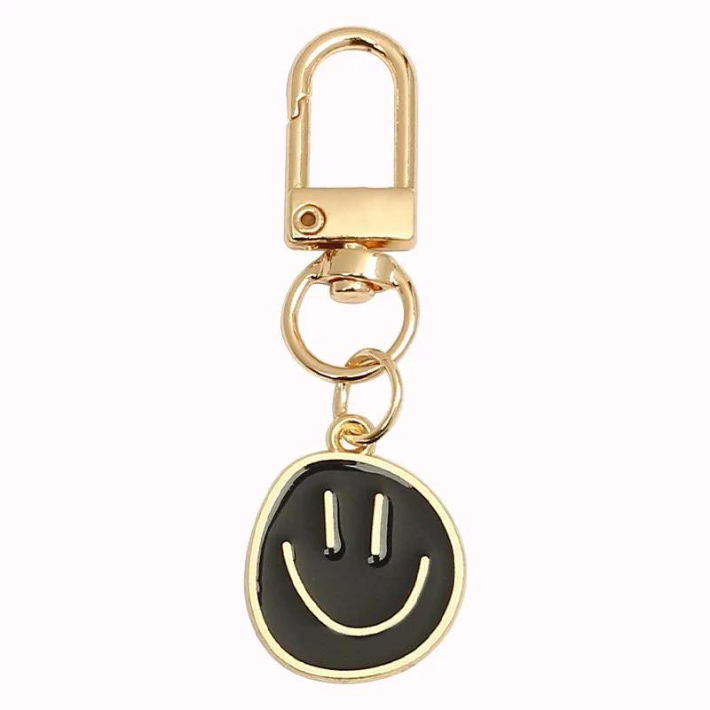 Lieblicher Smiley-Gesicht Schlüsselanhänger Niedlich Weiß Lila Gelb Rosa Blau Schwarz Emaille Metall Schlüsselring Taschenanhänger Zubehör Frauen Mädchen schwarz Lieblicher Smiley-Gesicht Schlüsselanhänger Niedlich Weiß Lila Gelb Rosa Blau Schwarz Emaille Metall Schlüsselring Taschenanhänger Zubehör Frauen Mädchen schwarz von Joom DACH