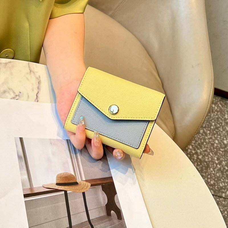 Neue, dreifach gefaltete Geldbörse aus Rindsleder mit Palmenmuster und Farbblockierung. Geldbörse aus echtem Leder mit farblich passendem Lederclip und Farbblockierung. Kartentasche 11.5x2.5x10cm gelb von Joom DACH