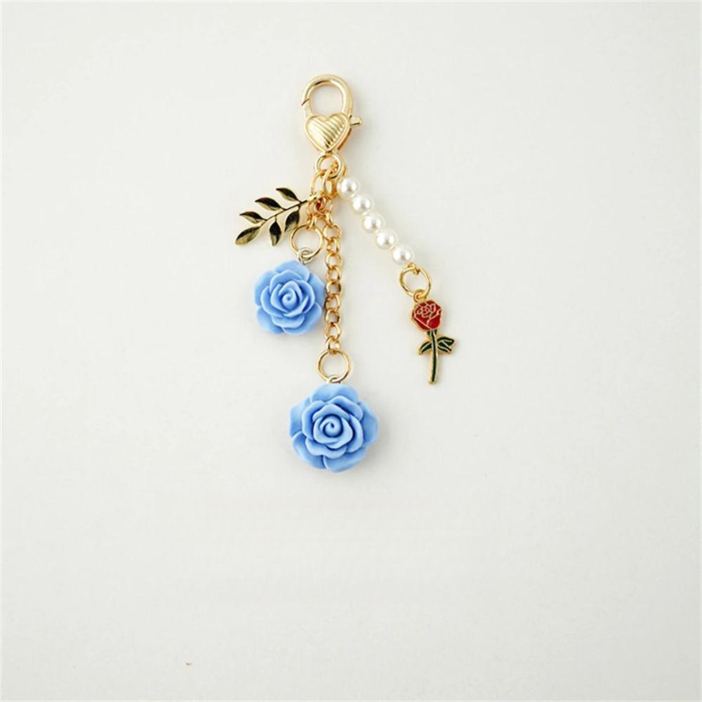 Rosen-Kamelien-Schlüsselanhänger für Damen und Mädchen, Perlenquaste, Blumen-Schlüsselanhänger, Taschendekoration blau Rosen-Kamelien-Schlüsselanhänger für Damen und Mädchen, Perlenquaste, Blumen-Schlüsselanhänger, Taschendekoration blau von Joom DACH