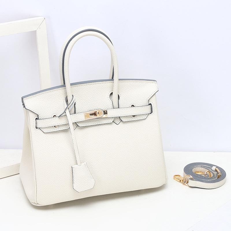 Togo Small Grain Top Layer Rindsleder Platin Tasche Damen Echtleder Modische Einzel-Schulter-Handtasche Textur Tasche 25x14x19cm luftwaffe blau von Joom DACH